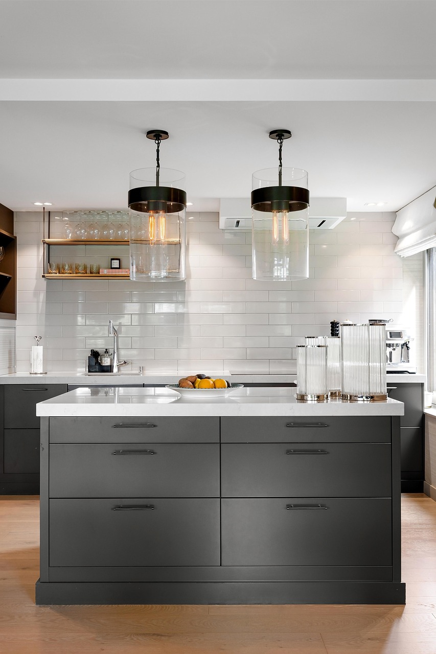 small kitchen with a chandelier, an island